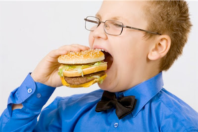 Funny kids eating fast food like hungry for years