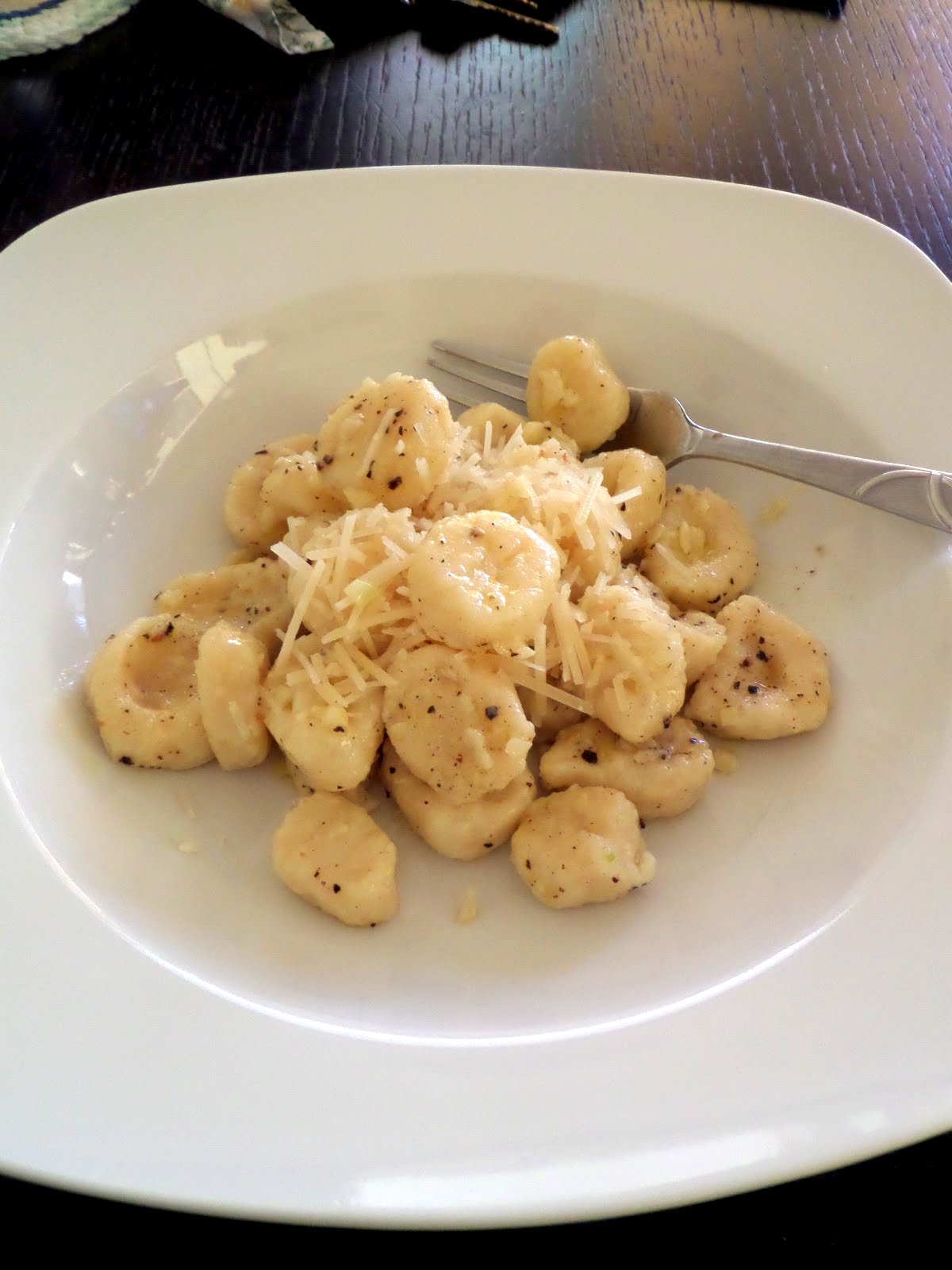 Garlic Butter Gnocchi:  Soft fluffy pillows of warm potato gnocchi tossed in a garlic butter sauce and topped with Parmesan cheese.