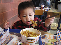 Alexandre enjoying his poutine!