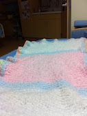 This blanket was knitted in the center and crocheted on the borders.