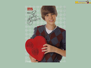 Green wallpaper of Justin Bieber with Hearth