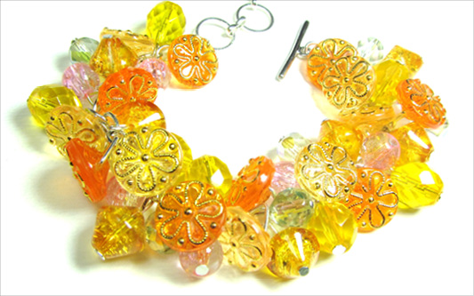 Vintage Style Glam Bracelet Dramatic bracelet has stunning yellow flower buttons and clusters of shiny Czech beads