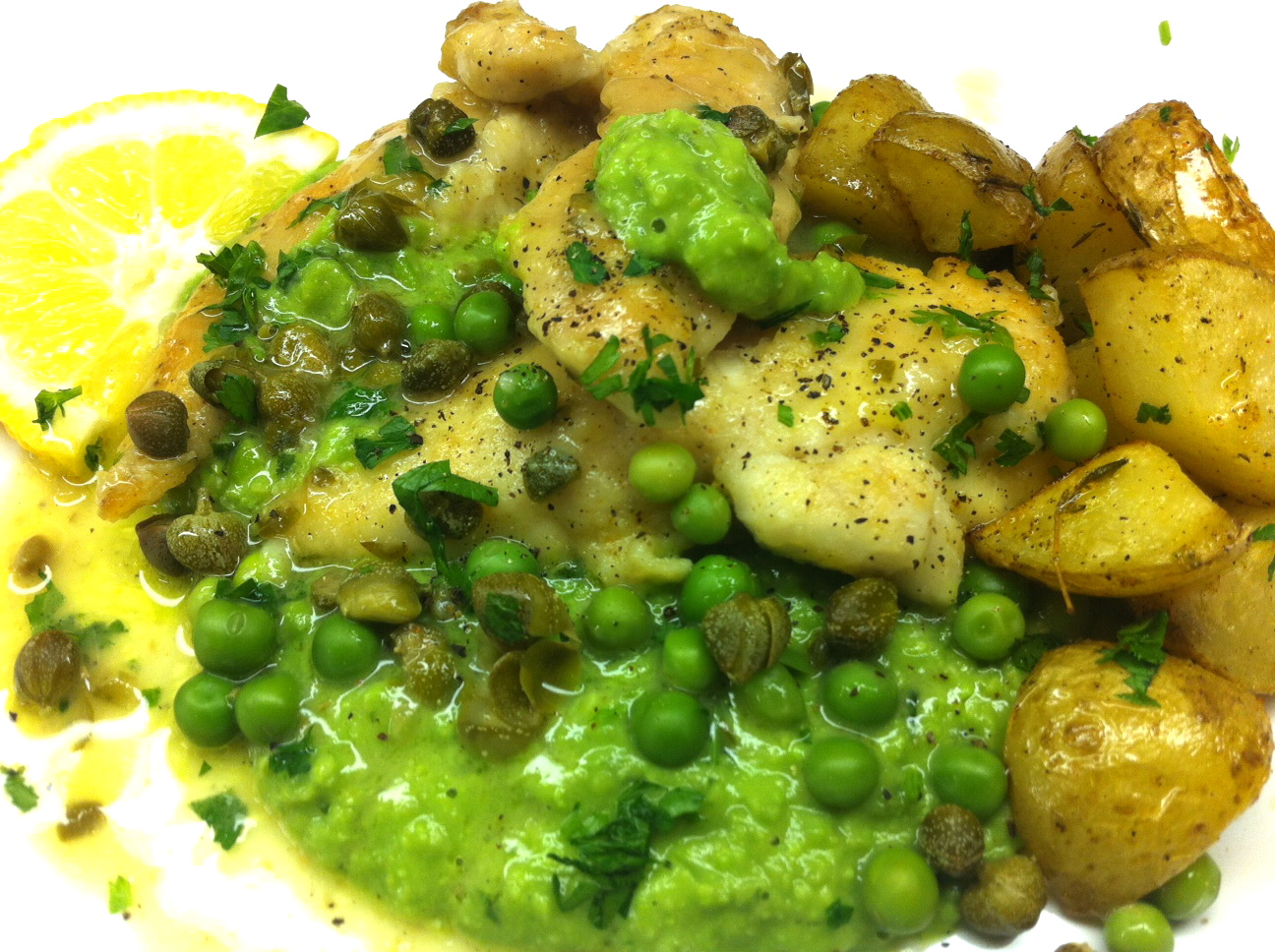lemon chicken with capers served over a {delicious} pea puree with oven