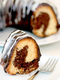 Chocolate Marble Ring Cake: Marbled chocolate and white sponge cake cooked in a ring mould that's covered with melted chocolate before servng