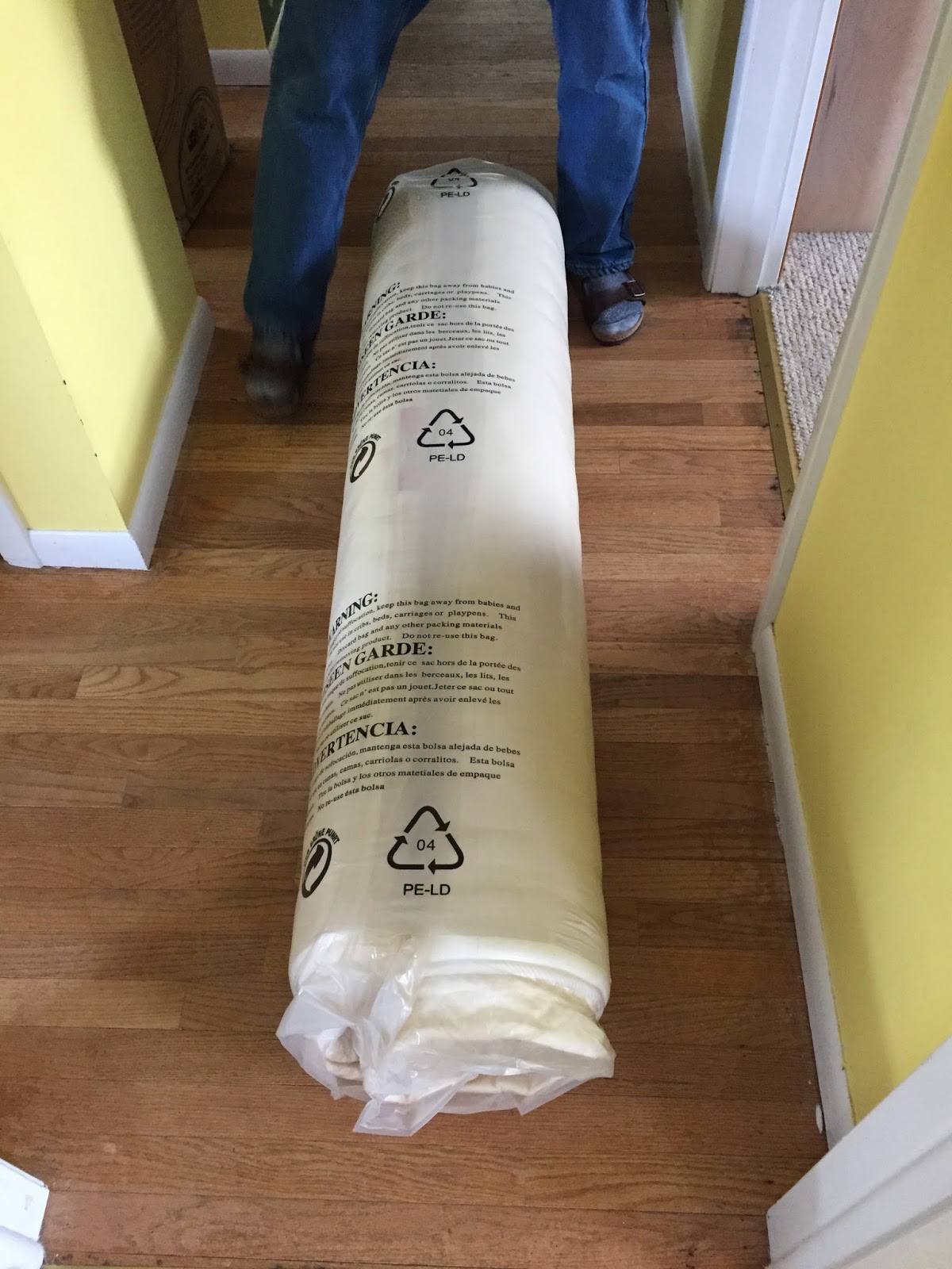 Photo of the mattress vacuum packed and rolled.