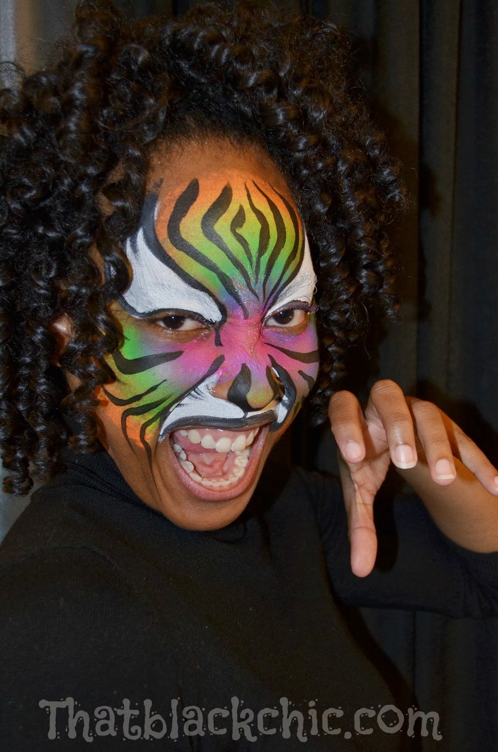 Giving back by volunteering Face Painting the kiddies That Black Chic