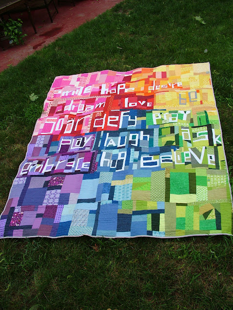 Kelli P: Rainbow Improv Quilt (photo: Lazy Gal Quilting)
