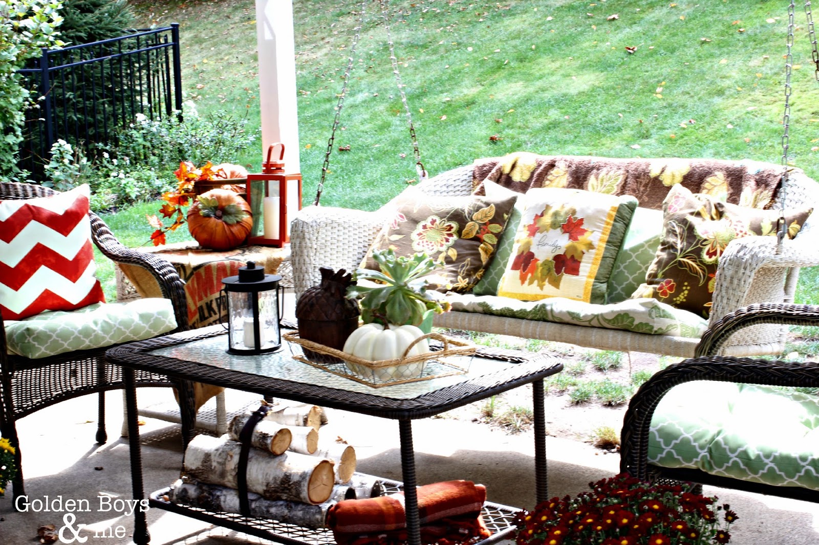 Fall decor with porch swing via www.goldenboysandme.com