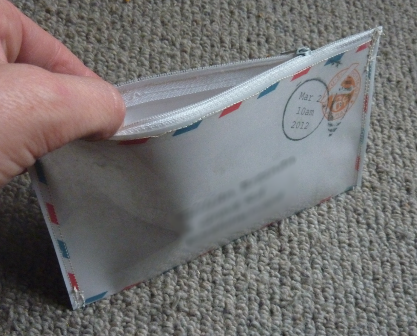 Jovial Spondoodles Sewing with laminated paper, and vinyl wallets from