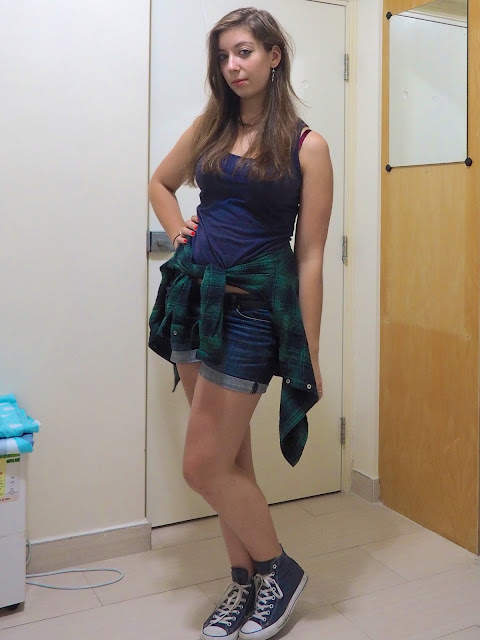 Tartan Takeover | outfit of blue vest top and denim shorts, with green checked shirt tied around the waist, and blue high top Converse sneakers