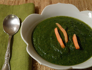 Bowl of Winter Greens Soup garnished with Carrot