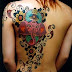 Elephant,sunflower and flower tattoos on full back