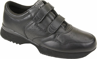 Picture of a black man's shoe with velcro closures instead of shoe laces.