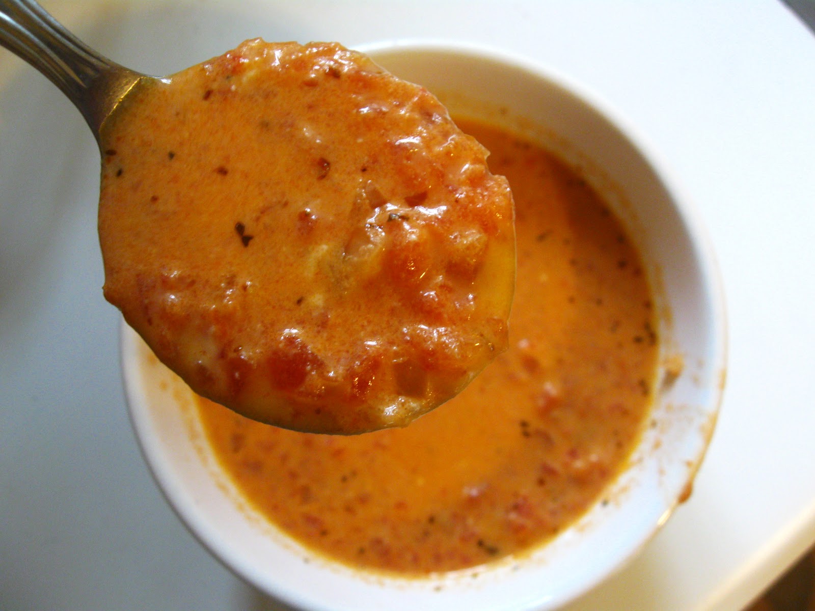 Above Hoarded Gold Tomato and Gouda Soup