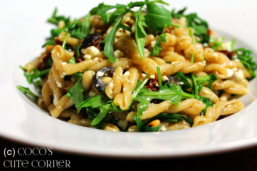 Pasta with sundried Tomatoes, Olives, Garlic, Pine Nuts and Rocket Salad