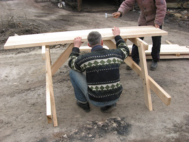 My friends Max and Alex are assembling outdoor table 