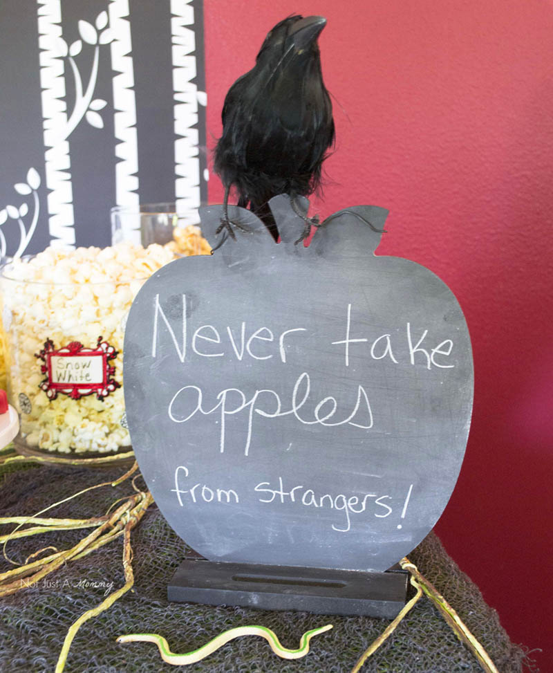 Disney's Descendants Watch Party; 'never take apples from strangers' chalkboard