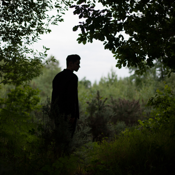 girl and guy in the forest at twilight
