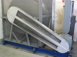 A nicely designed guard protects a Gates synchronous belt drive from dust and debris