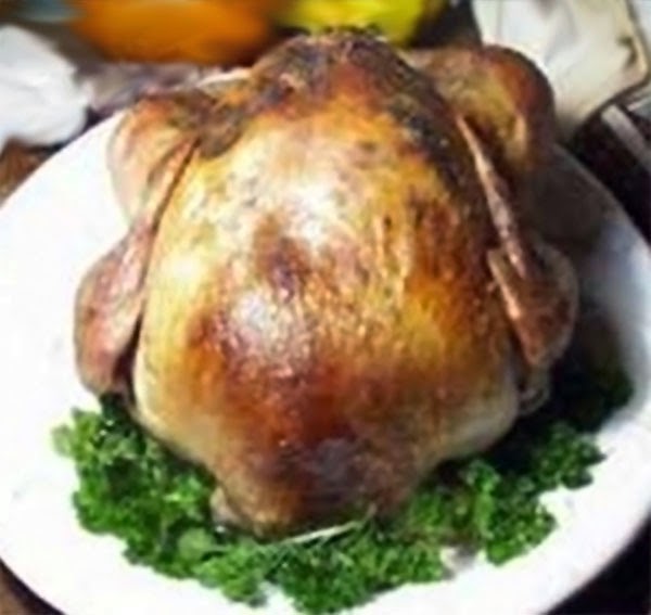 Honey-brined Herb-Roasted Turkey Recipe: A classic method of achieving a perfectly moist and flavourful turkey by marinating in a honeyed brine and roasting with mixed herbs. Shown served on a plate with a parsley garnish.