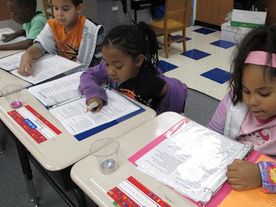 students practicing reading fluency with song lyrics