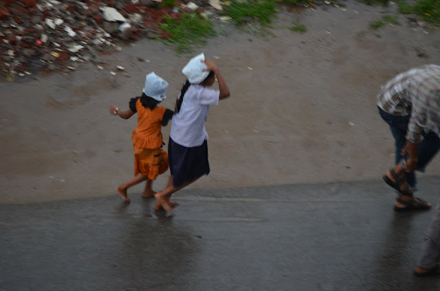 kids running in rains during monsoon