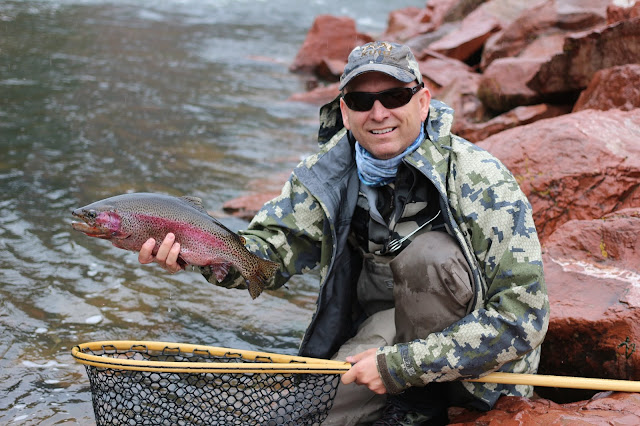 Jay%2BScott%2BPodcast%2Bwith%2Ba%2BColorado%2BRainbow%2Btrout%2Bwhile%2Bflyfishing.JPG