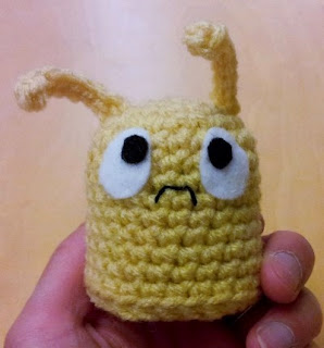sad little yellow crochet monster amigurumi