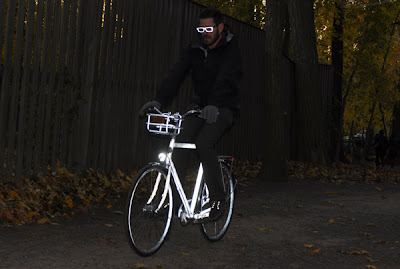 Bike being ridden at night, glowing white