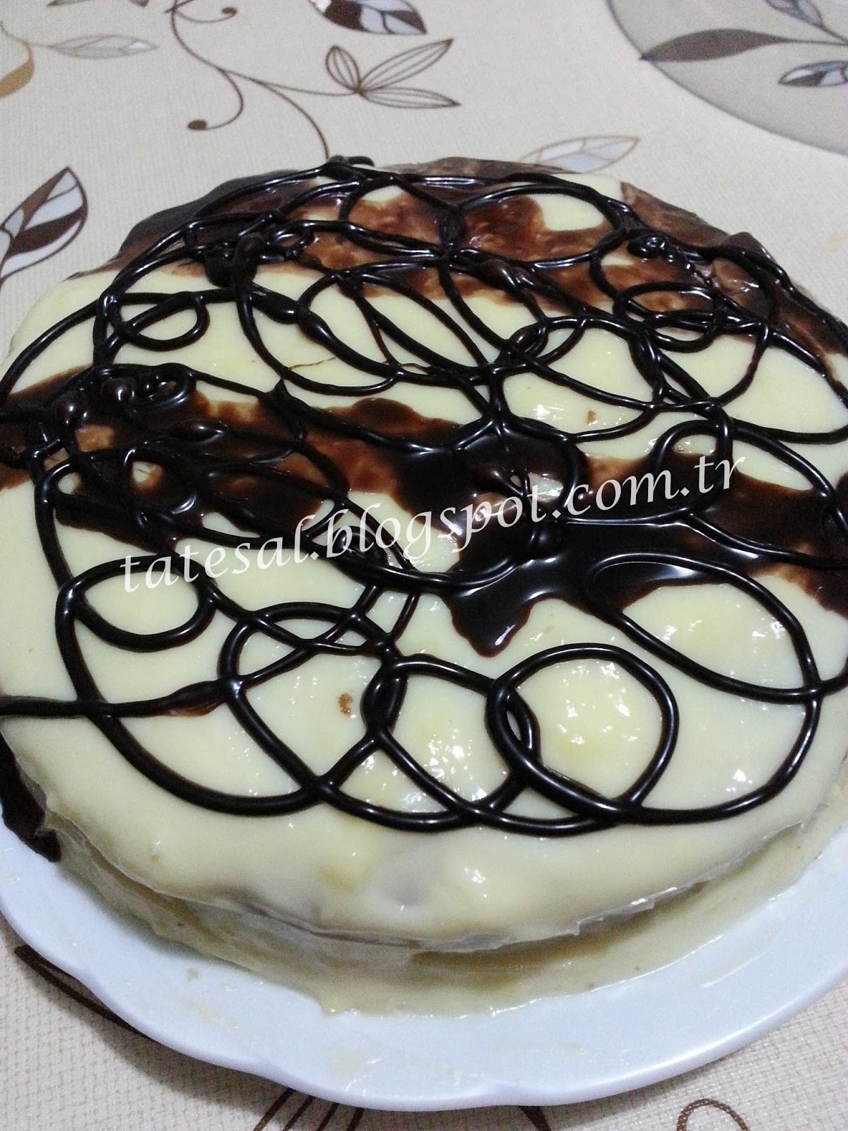 TATESAL İRMİKLİPORTAKALLIBEYAZ ÇİKOLATA SOSLU YAŞ PASTA