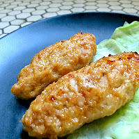 yakitori f tsukune of ground chicken with fresh ginger and onions.