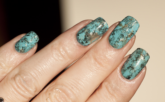 Turquoise water spotted manicure