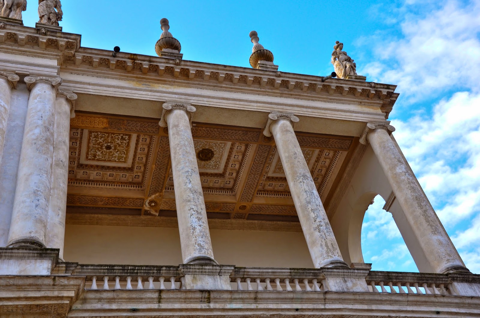 The upper balcony of Palazzo Chiericati in Vicenza, Italy against the blue skies of Veneto