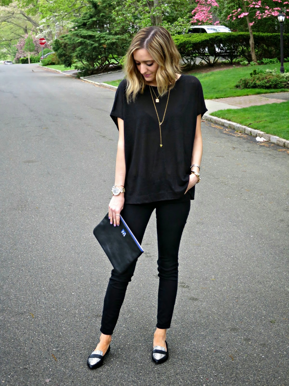 black outfit with gold jewelry