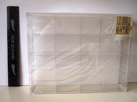 Muji display box with ruler next to it.