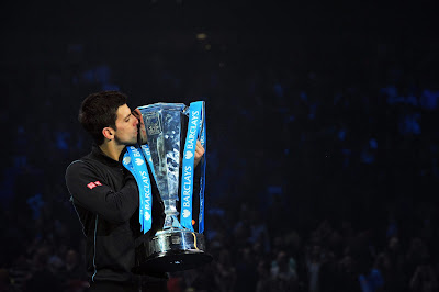Serbia's Novak Djokovic kisses the Brad Drewett Trophy after beating Spain's Rafael Nadal in the singles final on the eighth day of the ATP World Tour Finals tennis tournament in London on November 11, 2013. Djokovic won 6-3, 6-4.