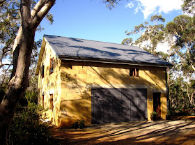 Exterior view of Hat Hill Cottage, a mud-brick cottage
