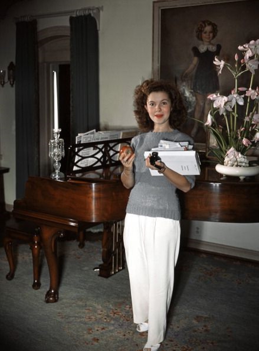Shirley Temple by her piano. 1944