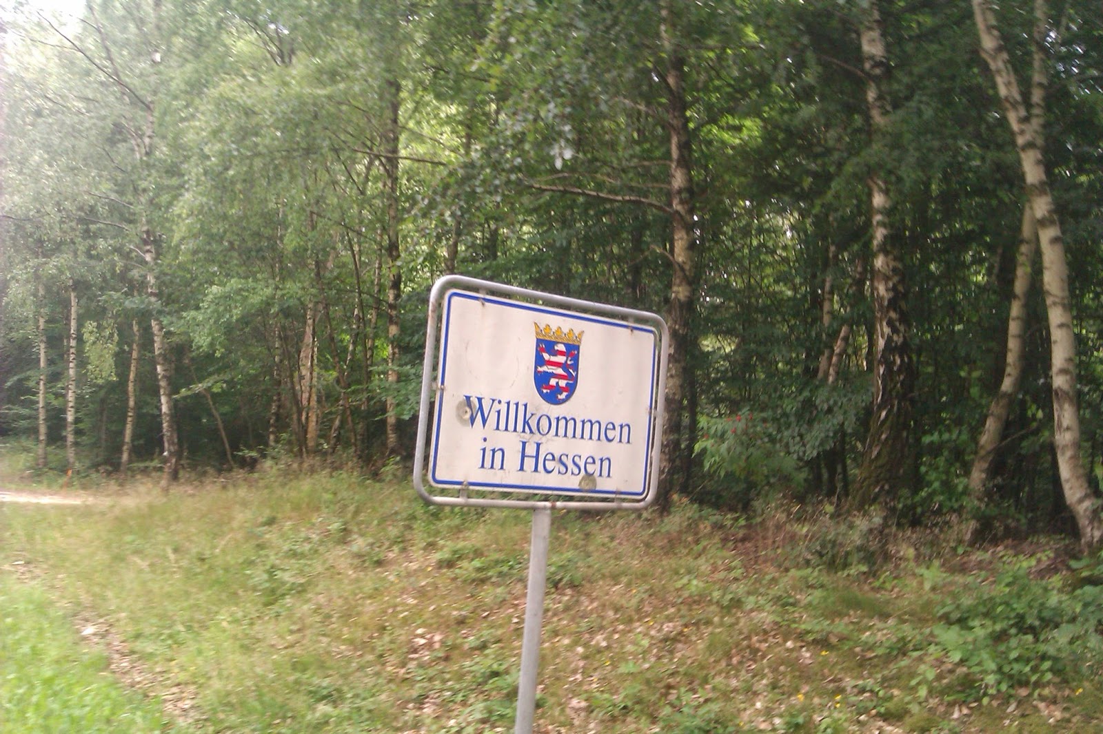 Welcome to Hessen Gunshot Bullet holes sign of the state of Hessen