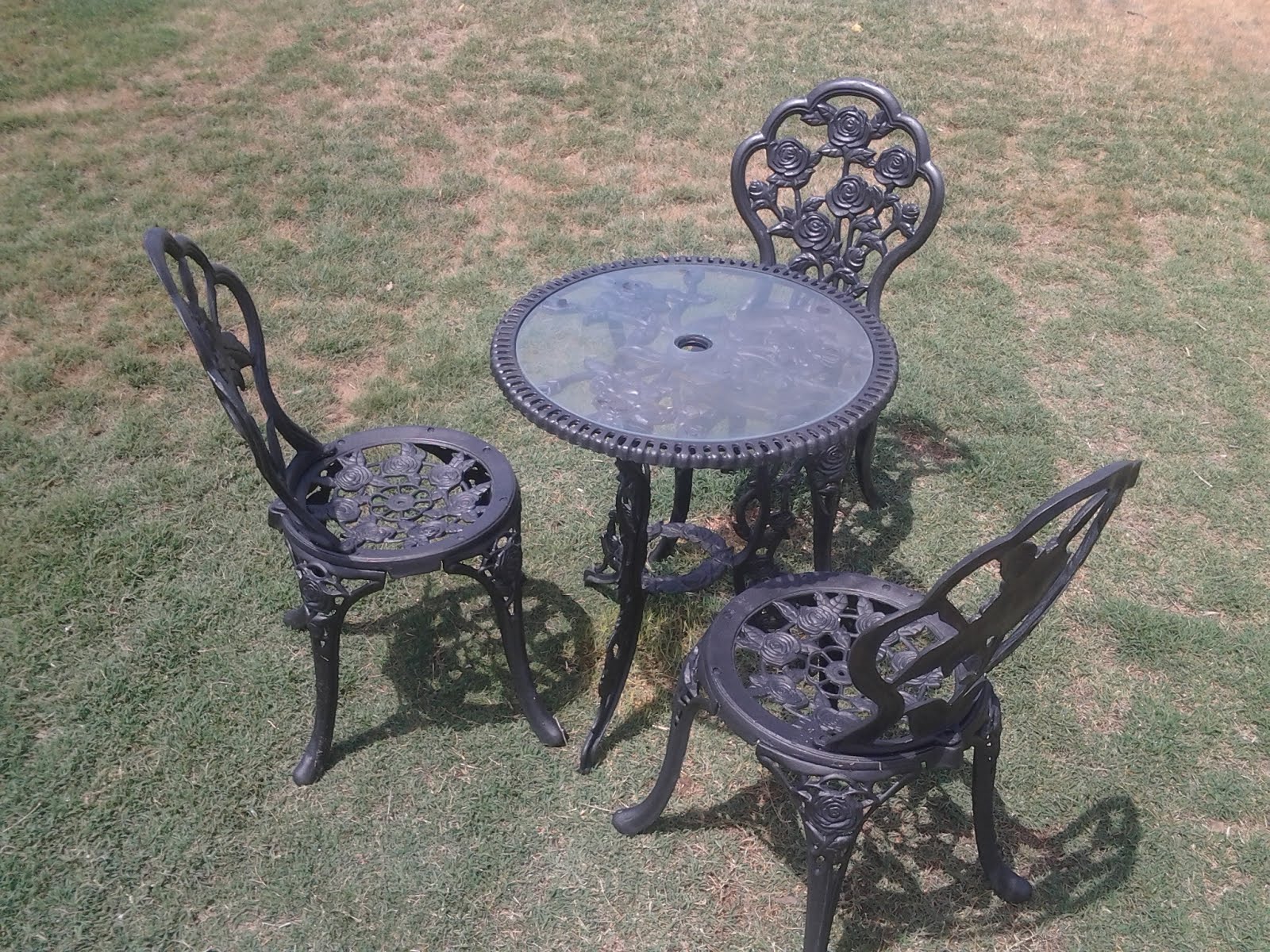 Real cast iron antique table and 3 chairs $sold