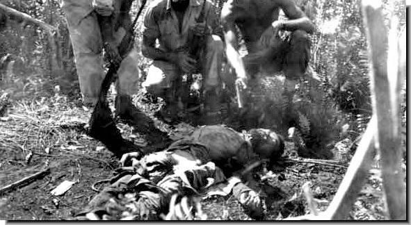 Dead Japanese Soldier Surrounded by American Soldiers