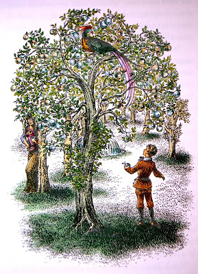 a boy stands next to a tree and looks up at a bird