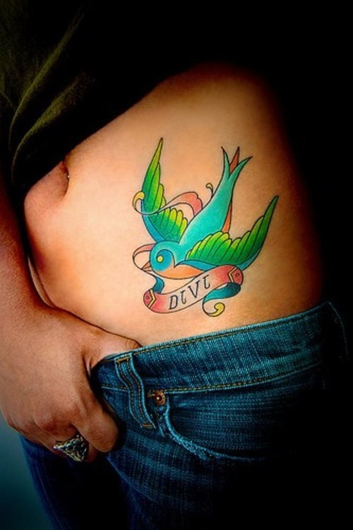 Pretty colorful bird tattoo on side body 