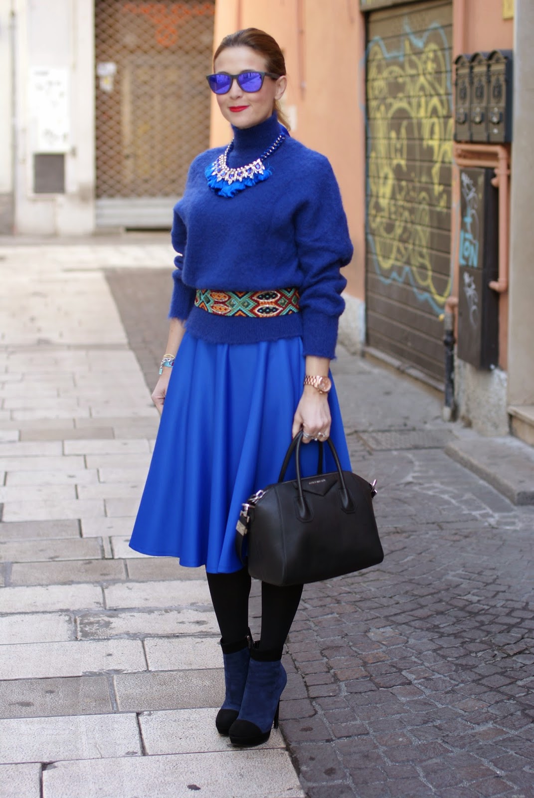 royal blue midi circle skirt, turtleneck sweater with tassel necklace, Fashion and Cookies, fashion blogger