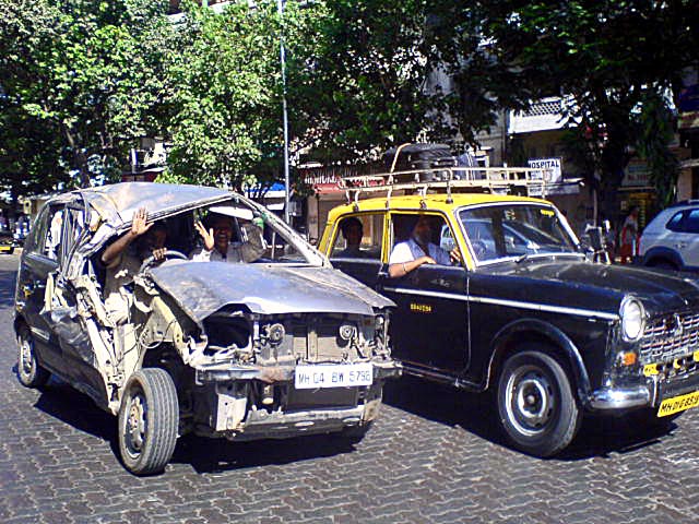 smashed and wrecked car being driven