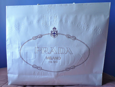What is a Prada Milano authenticity certificate card?
