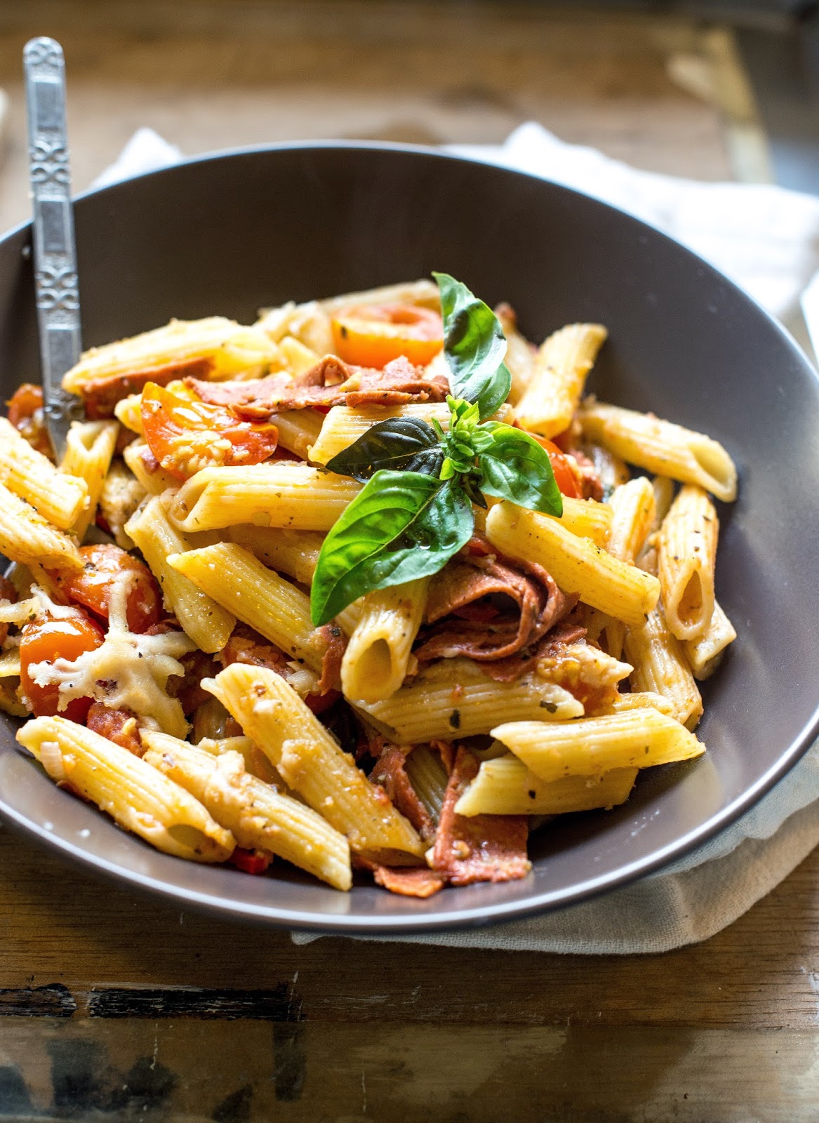 Vegan in Melbourne Vegan salami, tomato, and basil pasta bake.