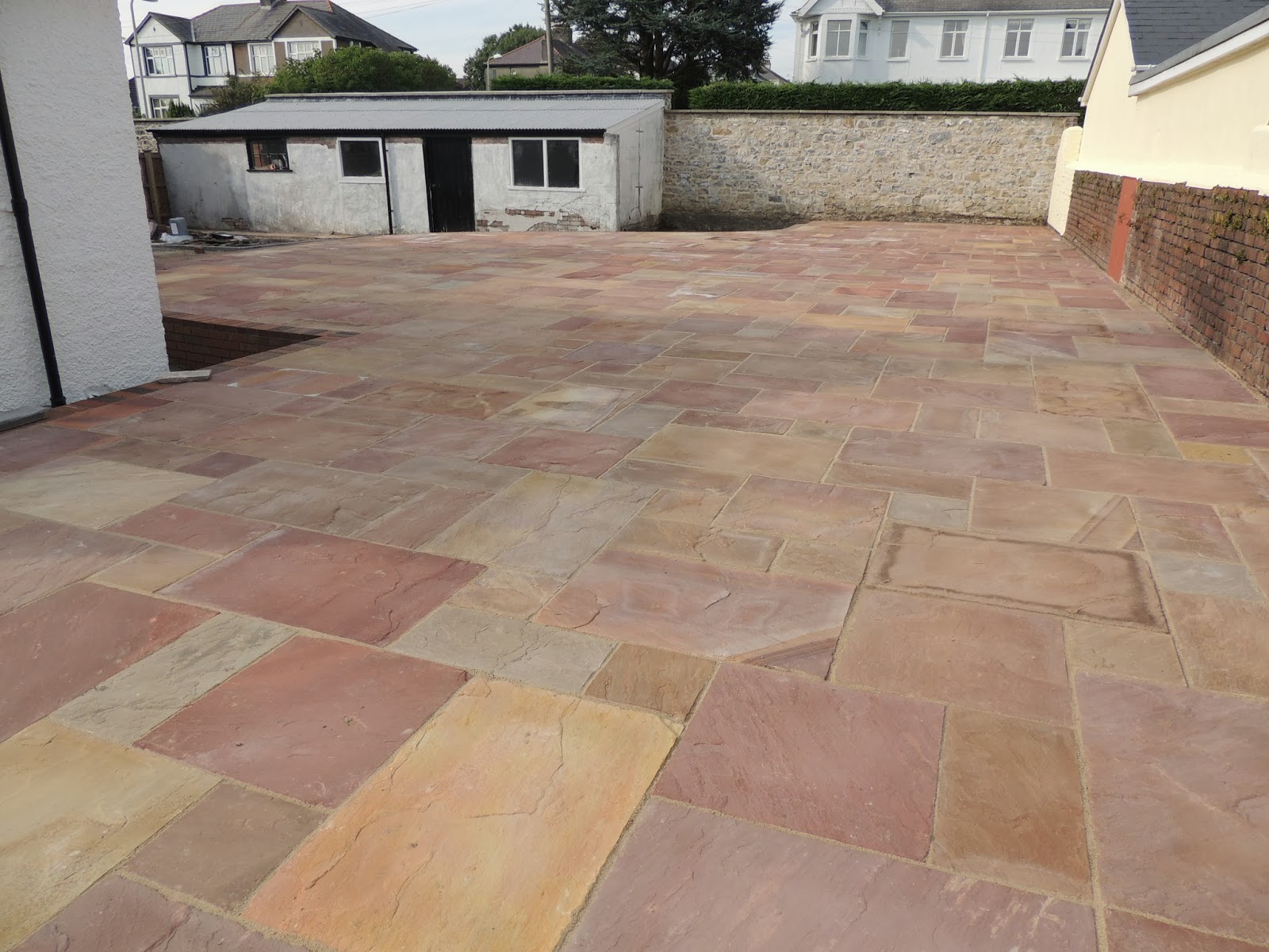 CWM LLYNFI BRICKLAYING Large patio using heather natural sandstone
