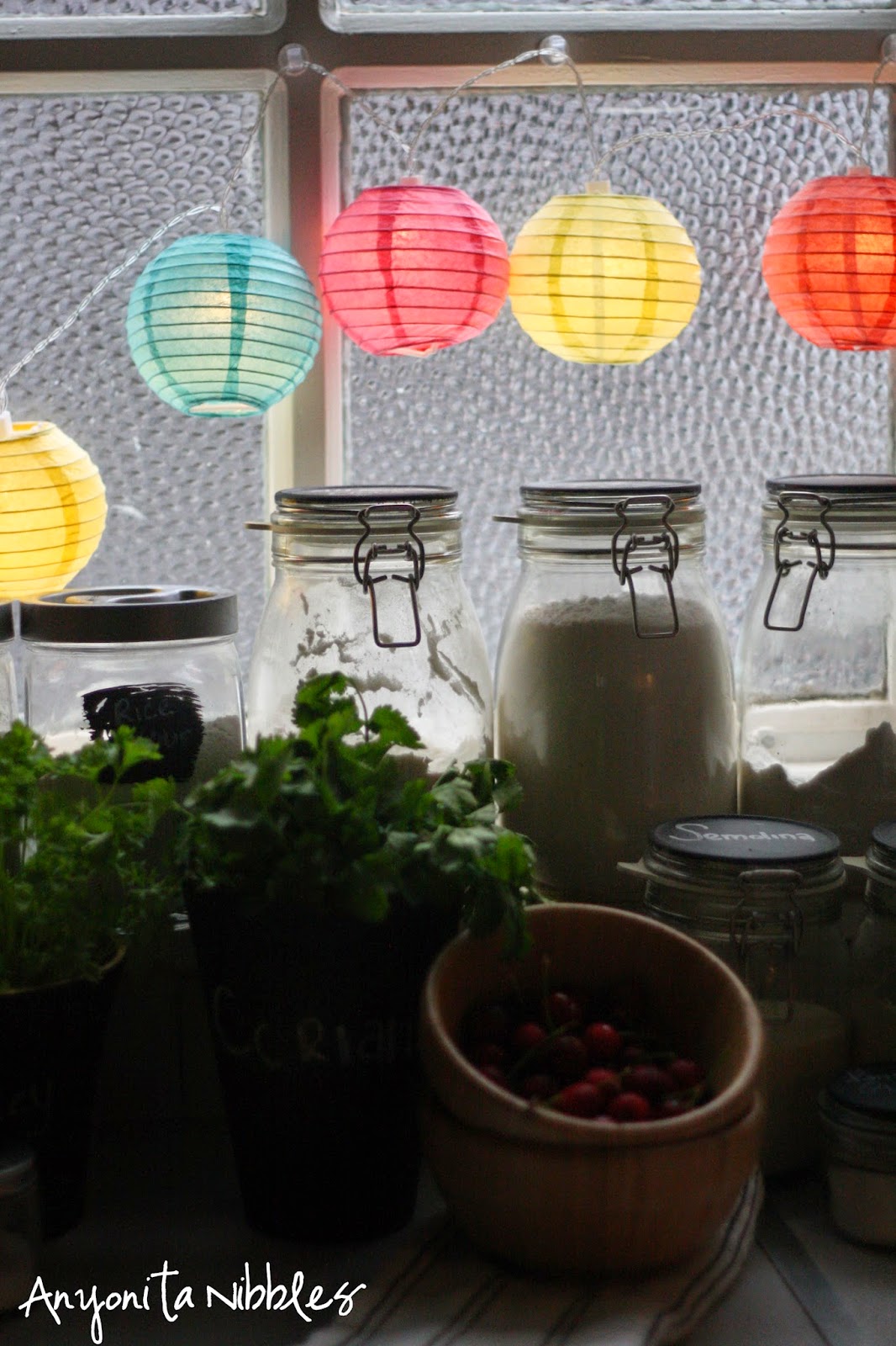 Paper lanterns add pop of color to a basic kitchen from Anyonita Nibbles