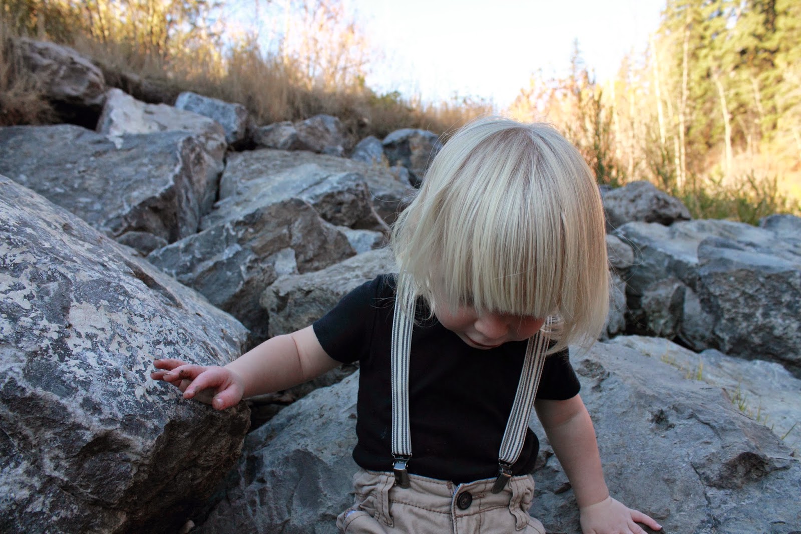 Boy climbing rocks